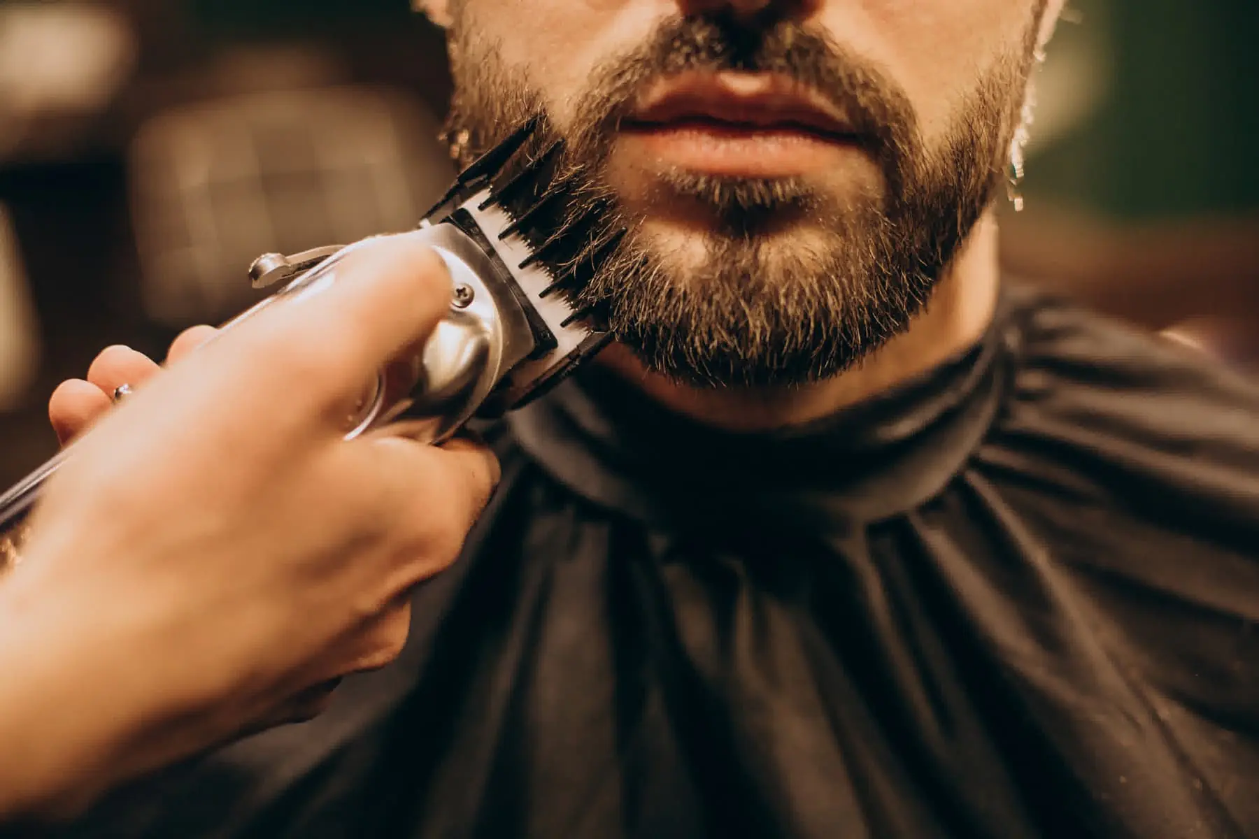 Barber finishing a sharp haircut at Blade and Bone
